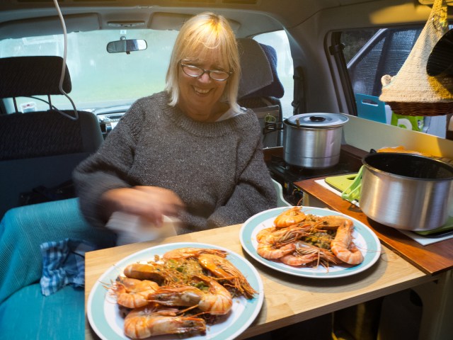 Sal works wonders with enormous prawns in the camper. 