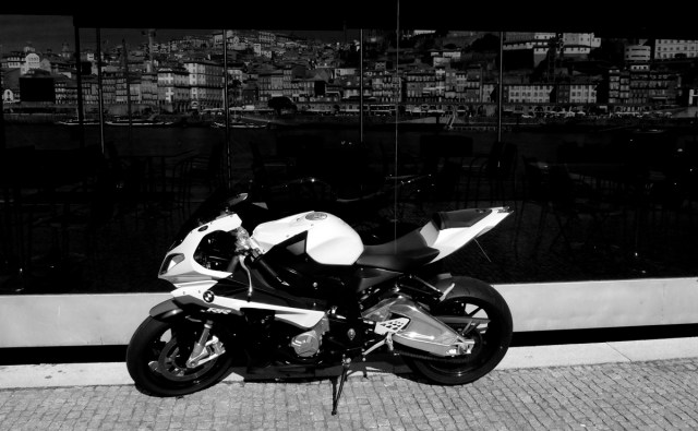 BMW in front of smoked glass.